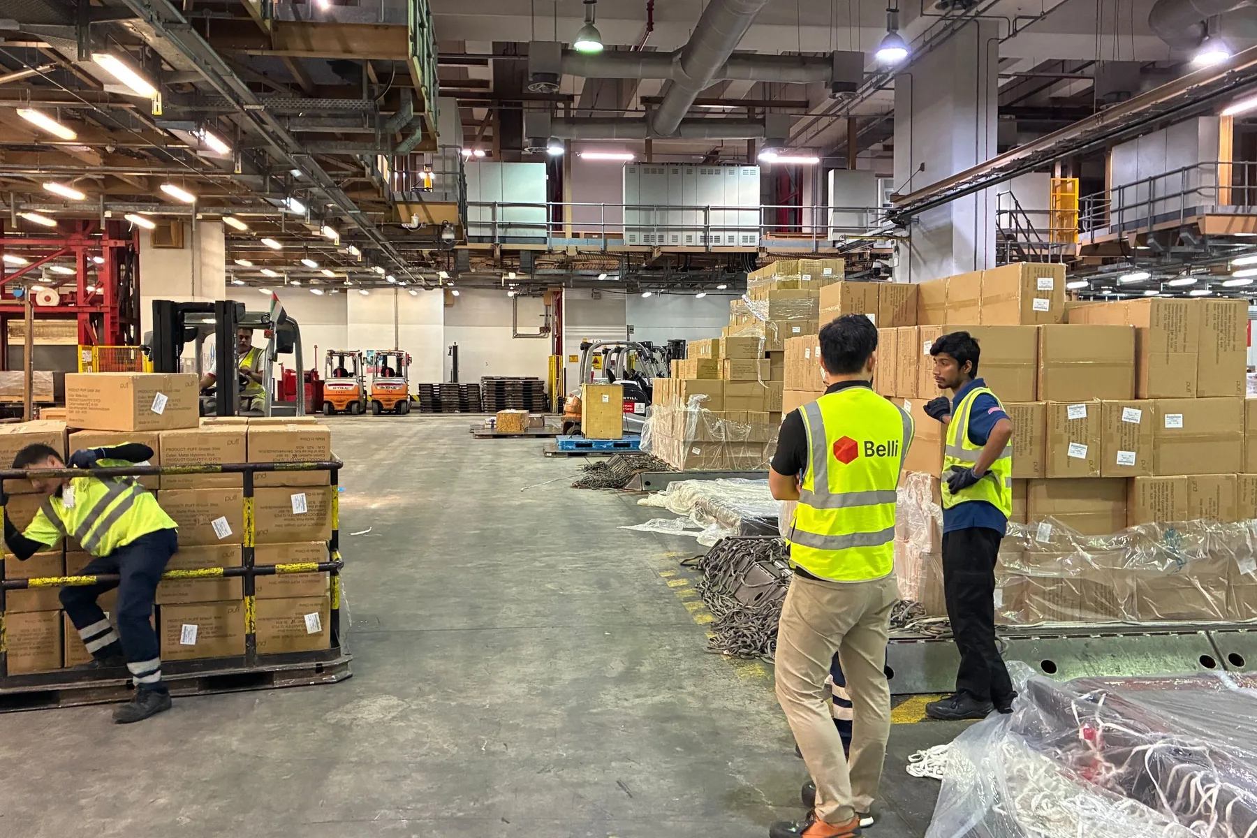 Belli and Emirates SkyCargo staff on the warehouse floor
